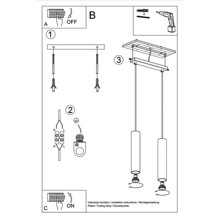 Suspension Long Cylindre 2 Or Poli installée dans une entrée, lumière douce diffusée par les cylindres dorés