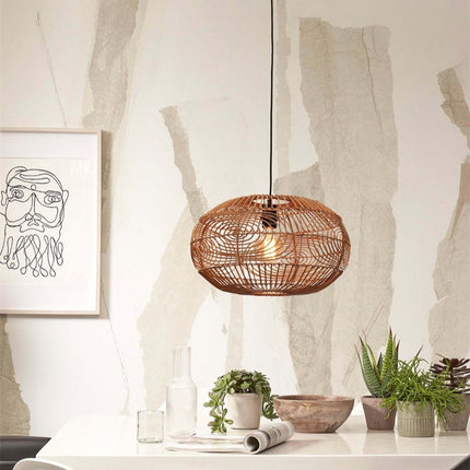 Pendant light Madeira in natural braided rattan above a dining table, atmosphere Japandi warm
