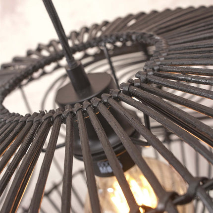 Detail of the top of the black rattan lampshade with the ceiling canopy and the textile cable of the Madeira pendant light