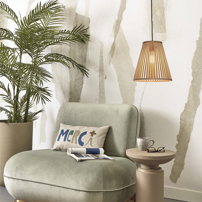 Pendant light Merapi bamboo natural lit near a green armchair in a corner reading cozy
