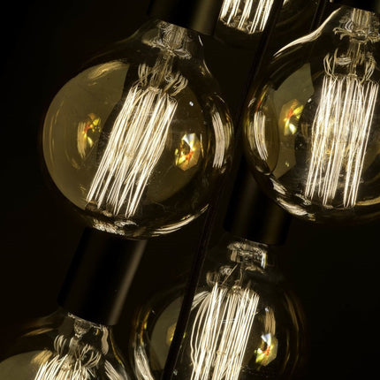 Ampoules à filament allumées sur la suspension Oslo 7 lumières noir mat, effet cascade
