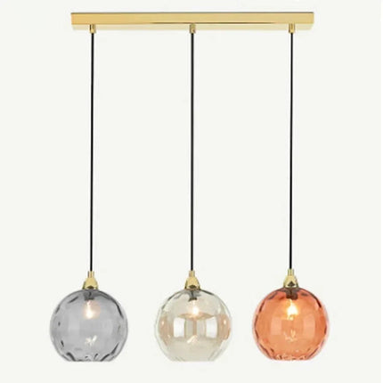 Suspension 3 têtes sur rampe linéaire dorée avec globes en verre soufflé gris, ambre et orange