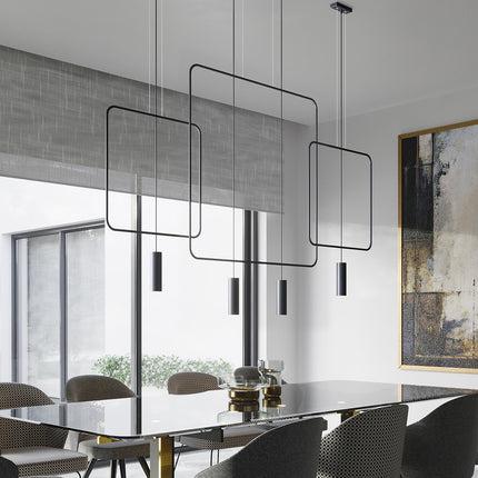 Suspensions rectangulaires filaires noires au-dessus d'une table à manger contemporaine
