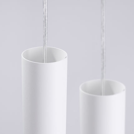 suspension ronde 3 tubes à embout ajouré spirale blanc, vue sur fond coloré