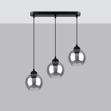 Vue de profil de la suspension triple Cloche, globes en verre fumé à hauteurs décalées