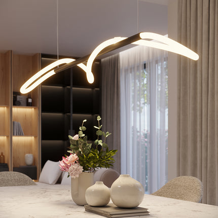 Suspension Tube LED Réglable noire allumée au-dessus d'une table à manger