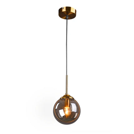 Detail of the glass lampshade of the pendant light with gold ring